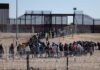 People waiting in line at border gate 40.