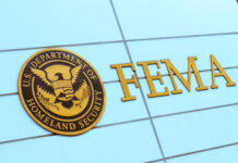 FEMA sign on building with Homeland Security seal.