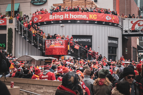 Crowd of Kansas City Chiefs fans celebrating outside McFadden's.