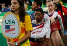 USA gymnasts waiting in line at an event.