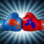 Red and blue boxing gloves representing political parties with stars