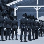 Uniformed soldiers standing in formation during a military ceremony