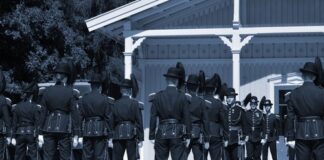 Uniformed soldiers standing in formation during a military ceremony