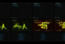 Thermal imaging display showing various military equipment and personnel