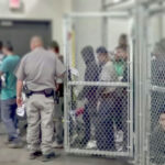 Bizarre ‘Zionist Prison’ Claim SPARKS Debate People detained behind fencing in a detention center.