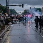 A tense standoff between law enforcement and protesters during a demonstration
