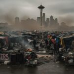 A view of a homeless encampment with the Seattle skyline in the background