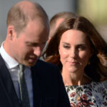 NEW Royal Scandal: Andrew’s Shocking Allegations Unfold… A couple walking together at an outdoor event, dressed in formal attire