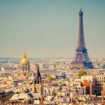 Eiffel Tower Erupts — Then It Turns VIOLENT Eiffel Tower and Paris skyline in daylight.