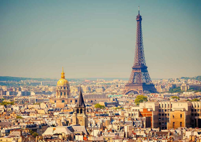 111362132 Eiffel Tower and Paris skyline in daylight.