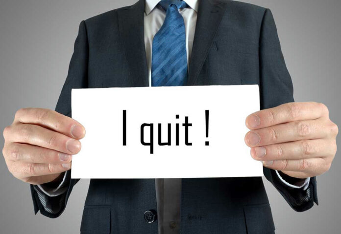 195128024 Person holding a sign that says I quit!.