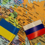 HOW CHEAP Drone Boats Have CHANGED THE WAR Ukrainian and Russian flags on map of Europe.