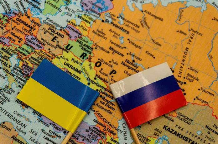 2109598166 Ukrainian and Russian flags on map of Europe.