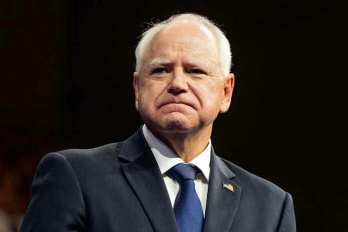 Man in suit with American flag pin.