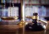 UNELECTED Elites Decide Abortion Map Scales of justice and gavel in courtroom.