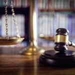 UNELECTED Elites Decide Abortion Map Scales of justice and gavel in courtroom.