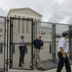 Security officials at the Supreme Court gates.