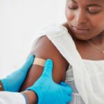 A healthcare professional administering a vaccine to a patient