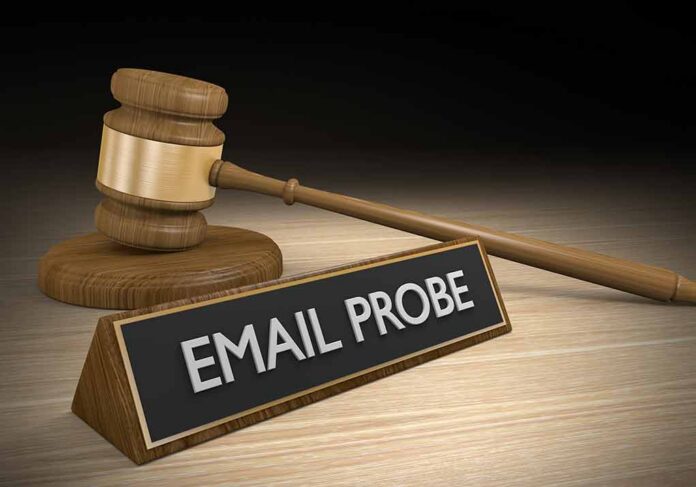 Judge’s gavel beside a nameplate reading EMAIL PROBE