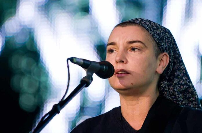singer with headscarf performing at a microphone